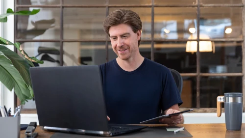 Man at desk with laptop